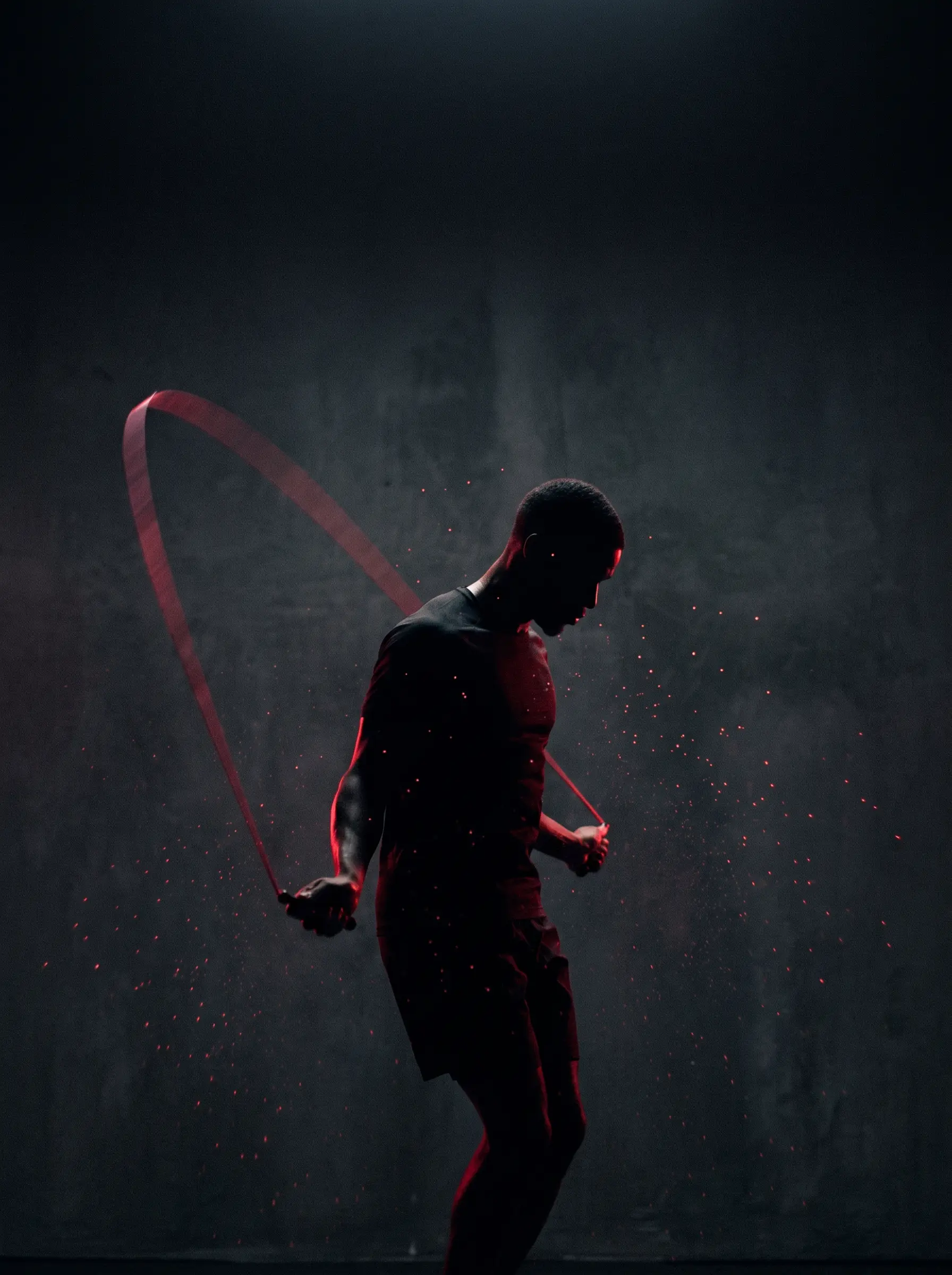 Silhouette of an athlete jumping rope