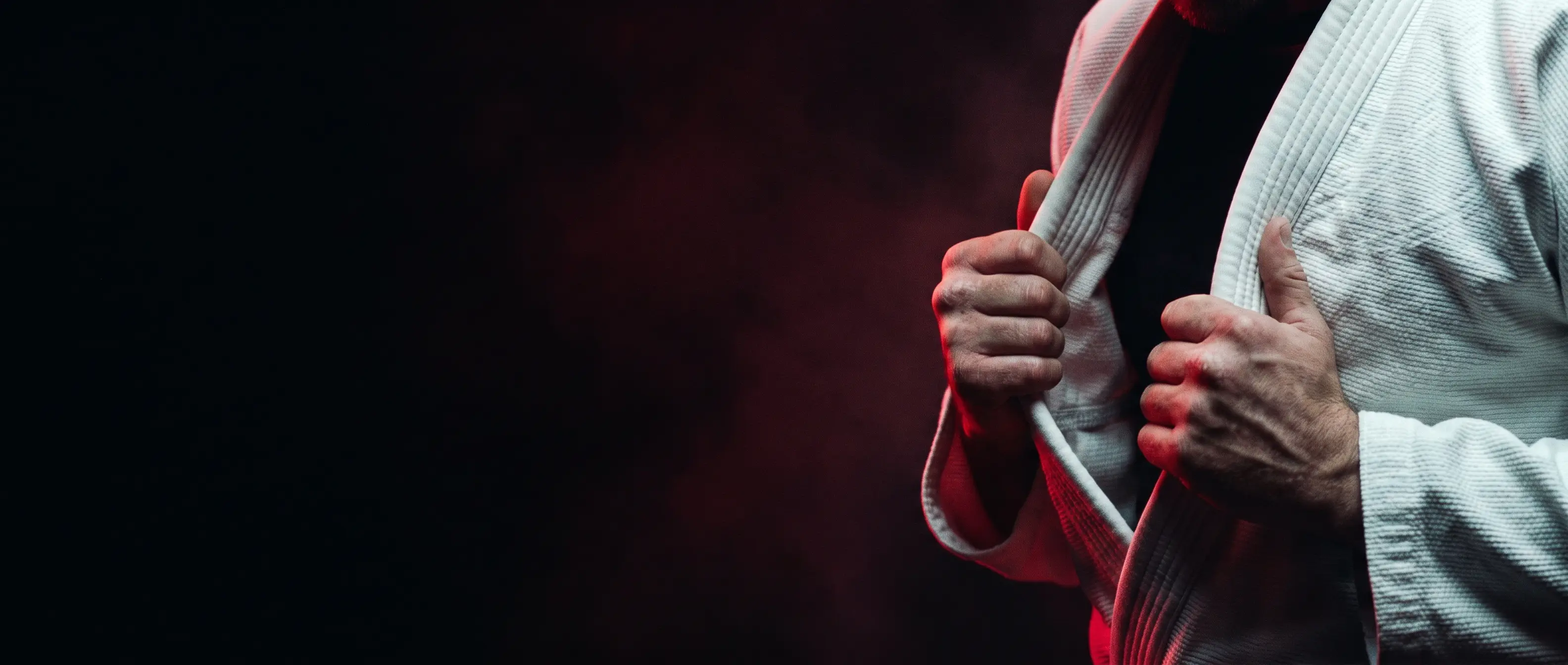 Hands gripping a gi collar